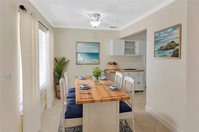 a dining room with furniture and window