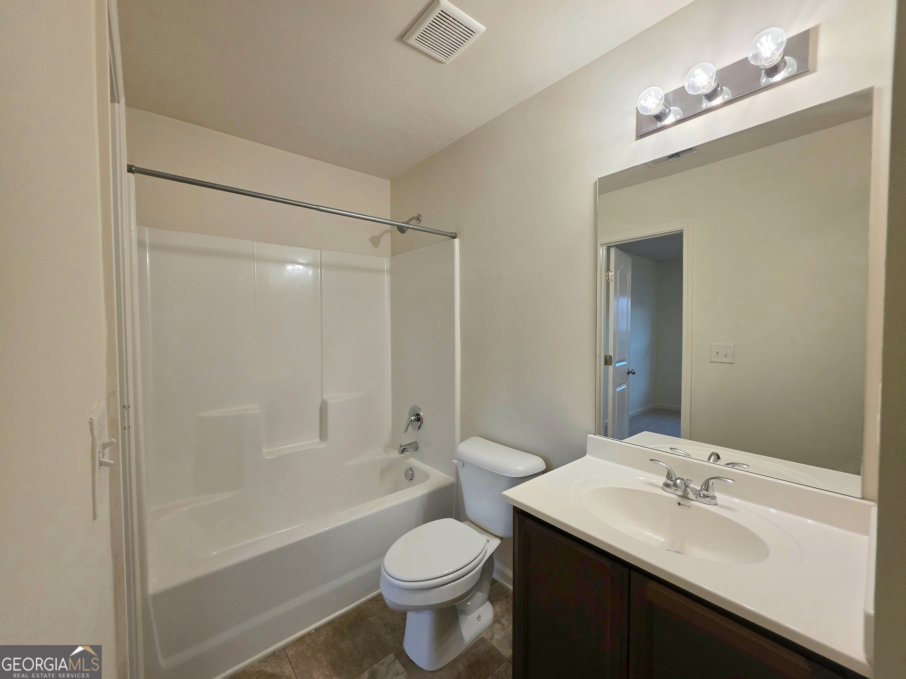 115 Wynne Street Macon, GA 31206 - Photo 6 of 8 a bathroom with a sink a toilet and shower