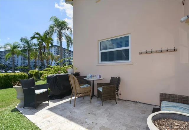 a outdoor living space with furniture and a potted plant
