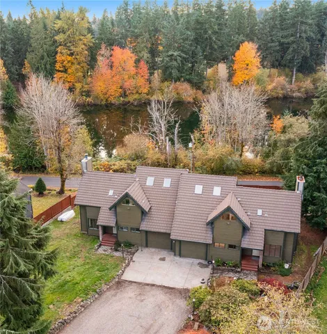 an aerial view of a house with a big yard