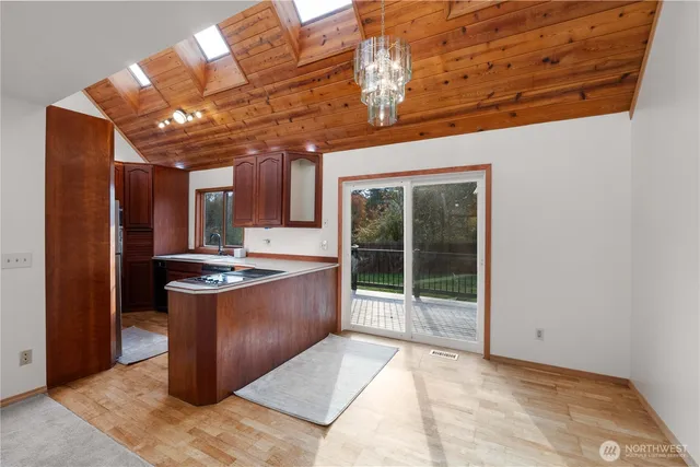 a view of an empty room with a fireplace