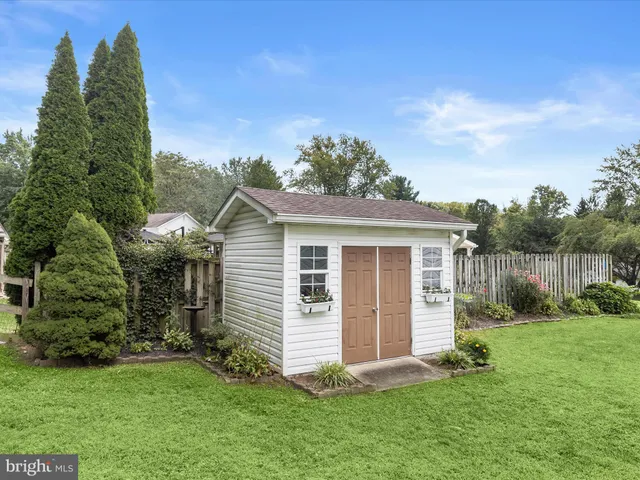 a view of green field with trees