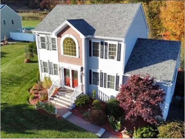 front view of a house with a yard
