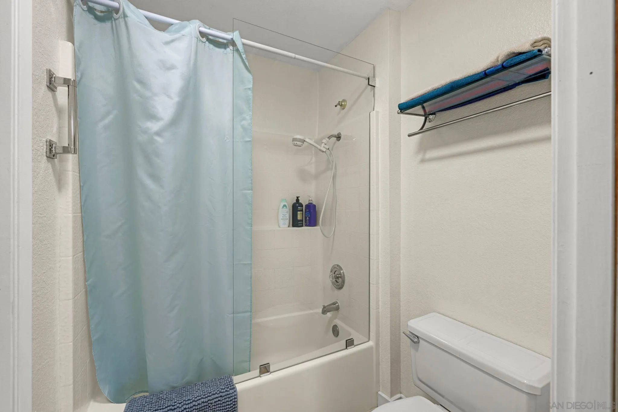 883 Ginger Avenue Carlsbad, CA 92011 - Photo 18 of 33 a bathroom with a shower and a toilet