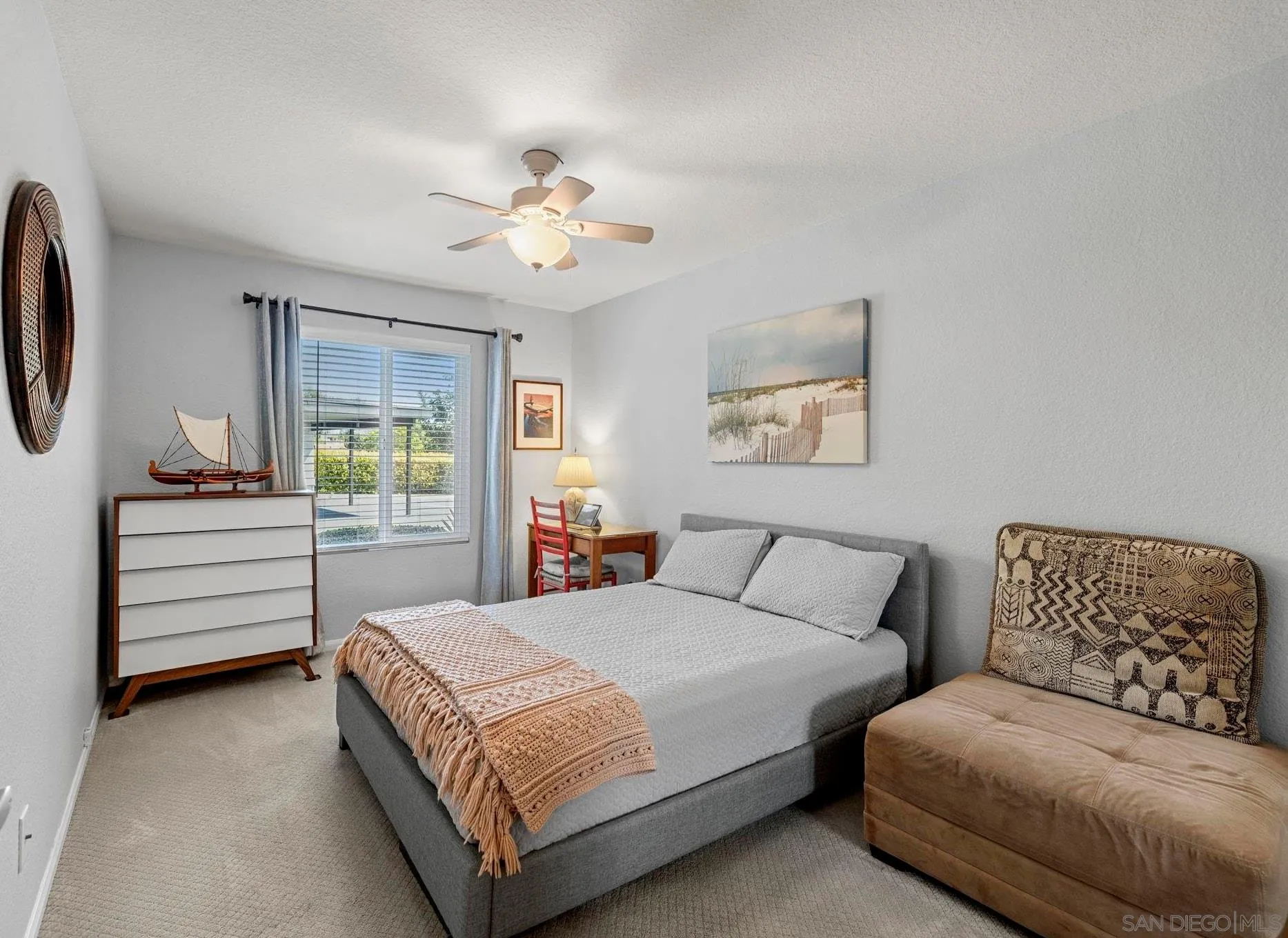 883 Ginger Avenue Carlsbad, CA 92011 - Photo 19 of 33 a bedroom with a large bed and a chandelier