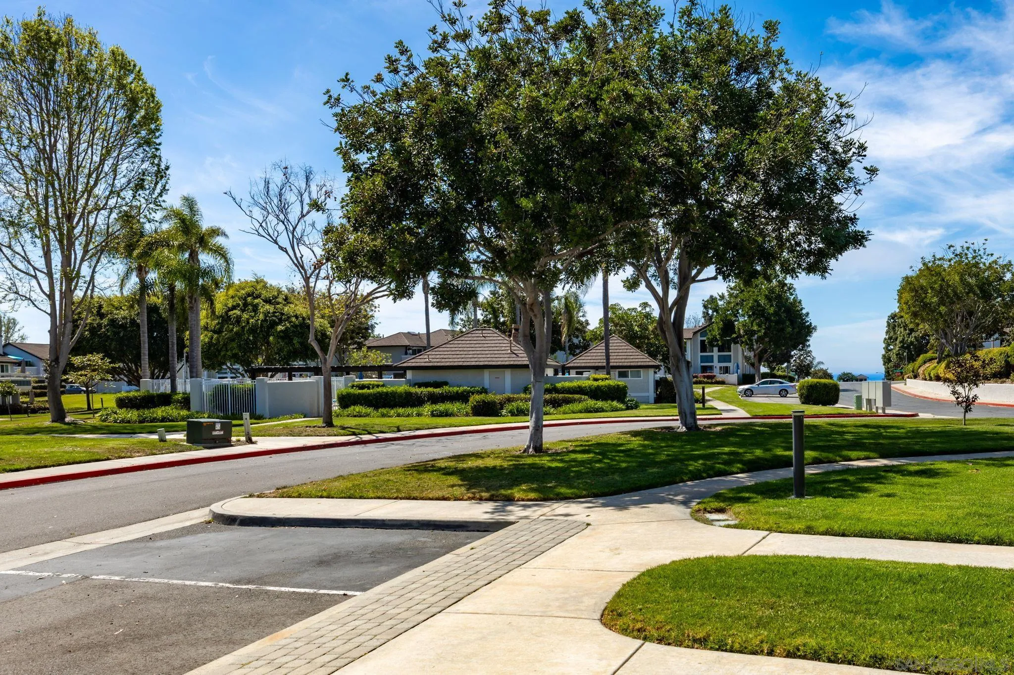 883 Ginger Avenue Carlsbad, CA 92011 - Photo 25 of 33 a view of a park with swings and slides