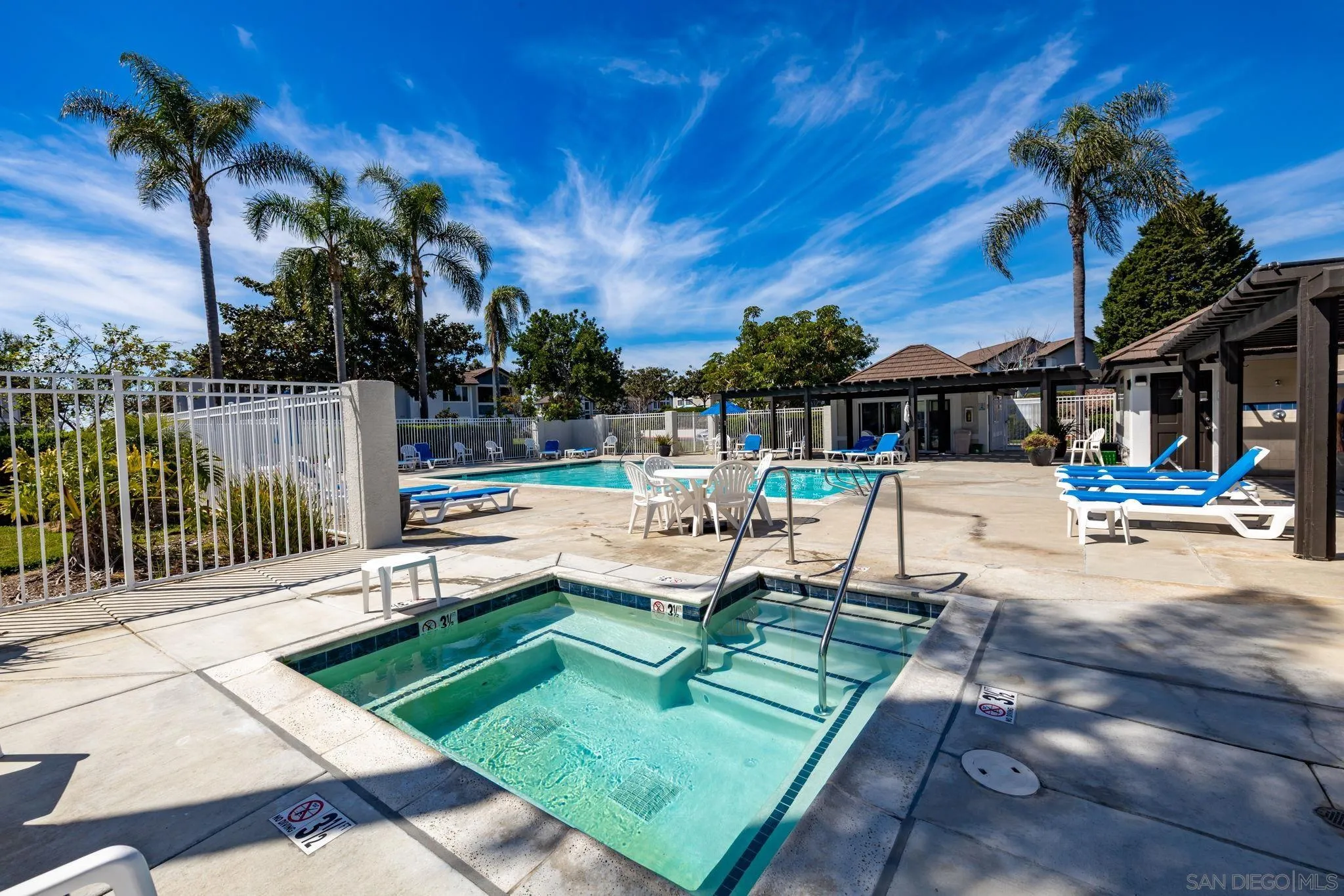 883 Ginger Avenue Carlsbad, CA 92011 - Photo 31 of 33 a view of a swimming pool with a lounge chair and swimming pool