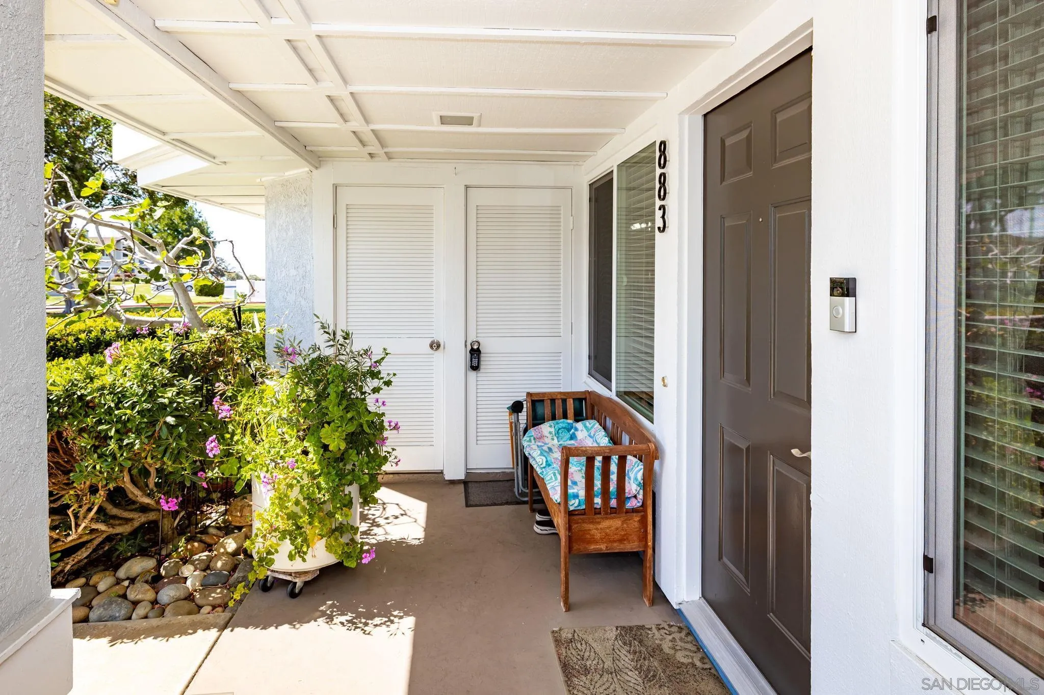 883 Ginger Avenue Carlsbad, CA 92011 - Photo 4 of 33 a hallway with wooden floor and a potted plant