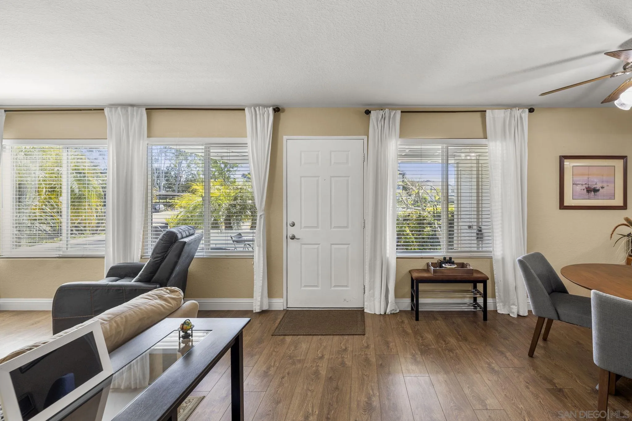 883 Ginger Avenue Carlsbad, CA 92011 - Photo 5 of 33 a living room with furniture and a wooden floor