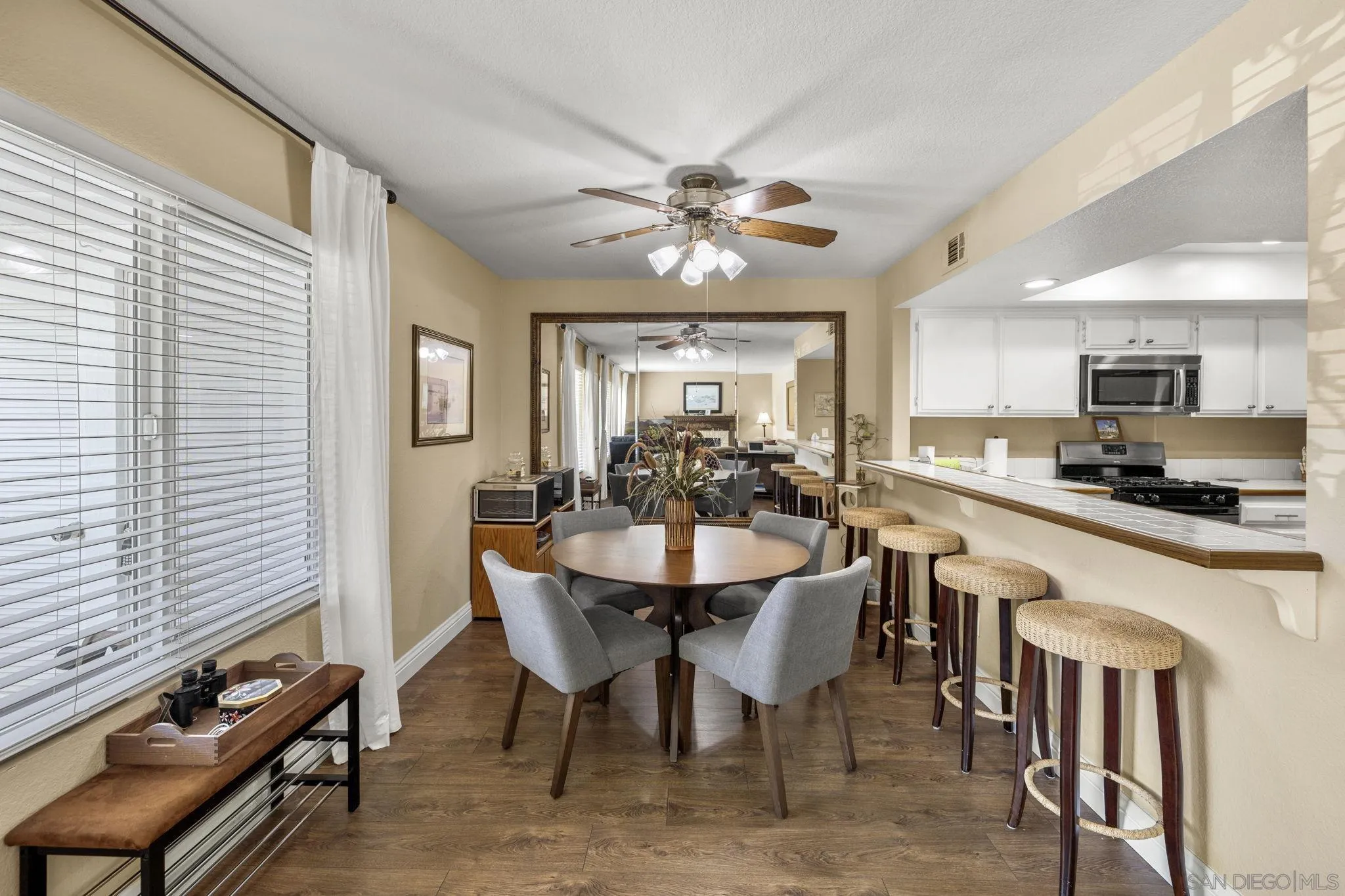 883 Ginger Avenue Carlsbad, CA 92011 - Photo 10 of 33 a view of a dining room with furniture and window