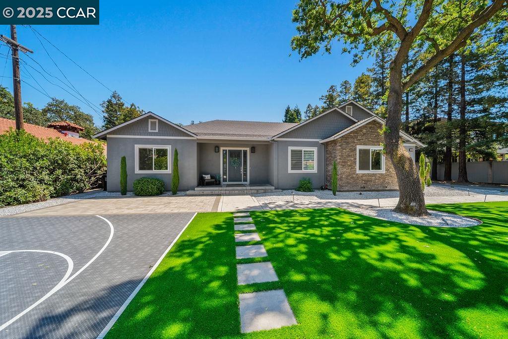 a front view of a house with a yard