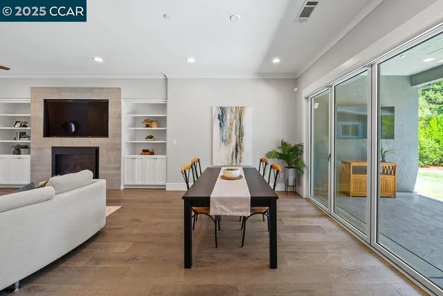 a view of a livingroom with furniture window and a fireplace