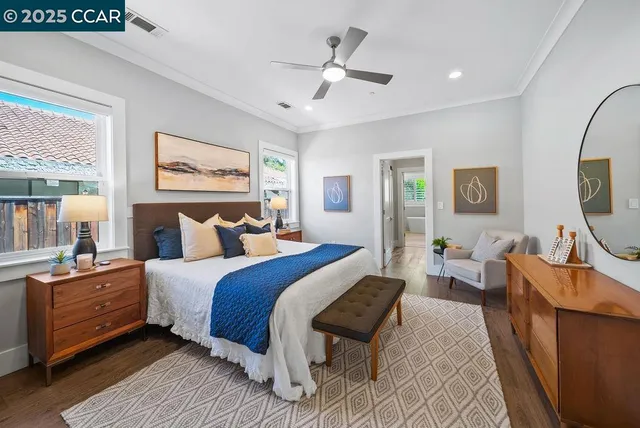 a bedroom with bed and wooden floor