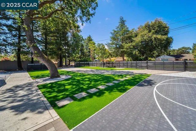 a view of a house with a yard and a garage
