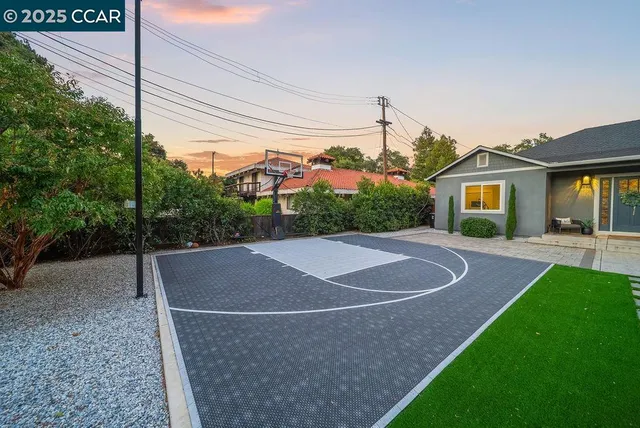 a view of a backyard with sitting area