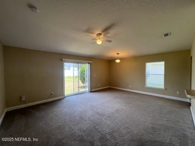 a kitchen with a refrigerator sink and cabinets