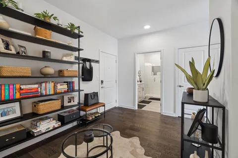 a room with furniture closet and a flat screen tv