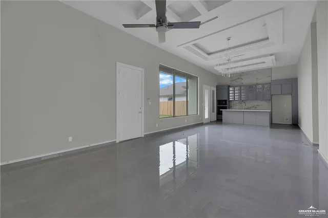 a view of a livingroom with a dishwasher and furniture
