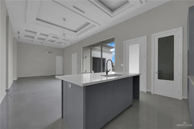 a kitchen with sink and cabinets