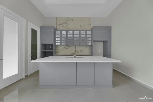 a view of a kitchen with a sink