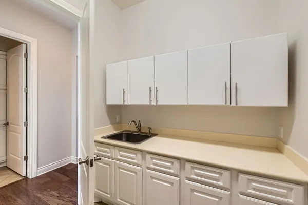 a kitchen with a sink cabinets and appliances