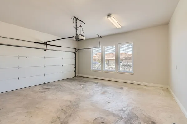 a view of a room with window and ceiling fan
