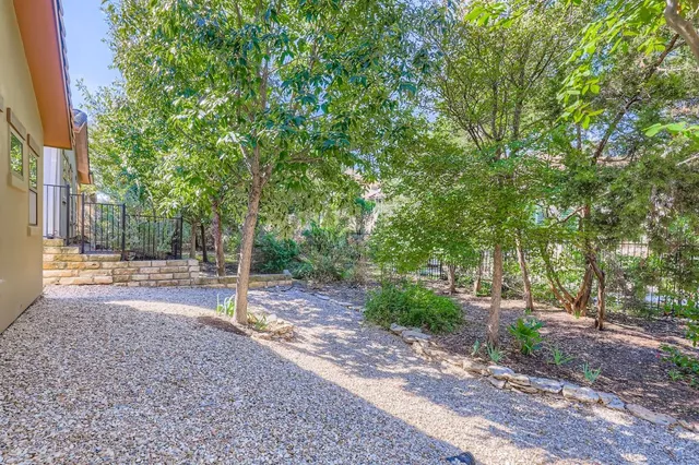 a backyard of a house with lots of green space