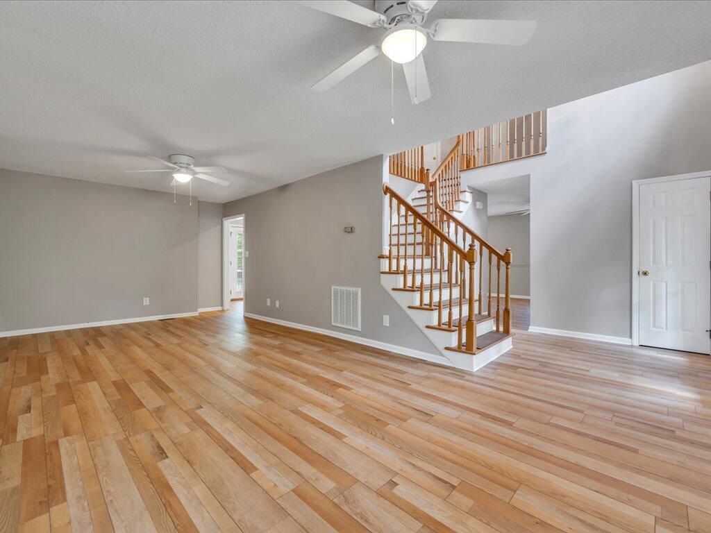 520 Scenic Drive Stuart, VA 24171 - Photo 13 of 83 a view of an empty room with wooden floor and fan