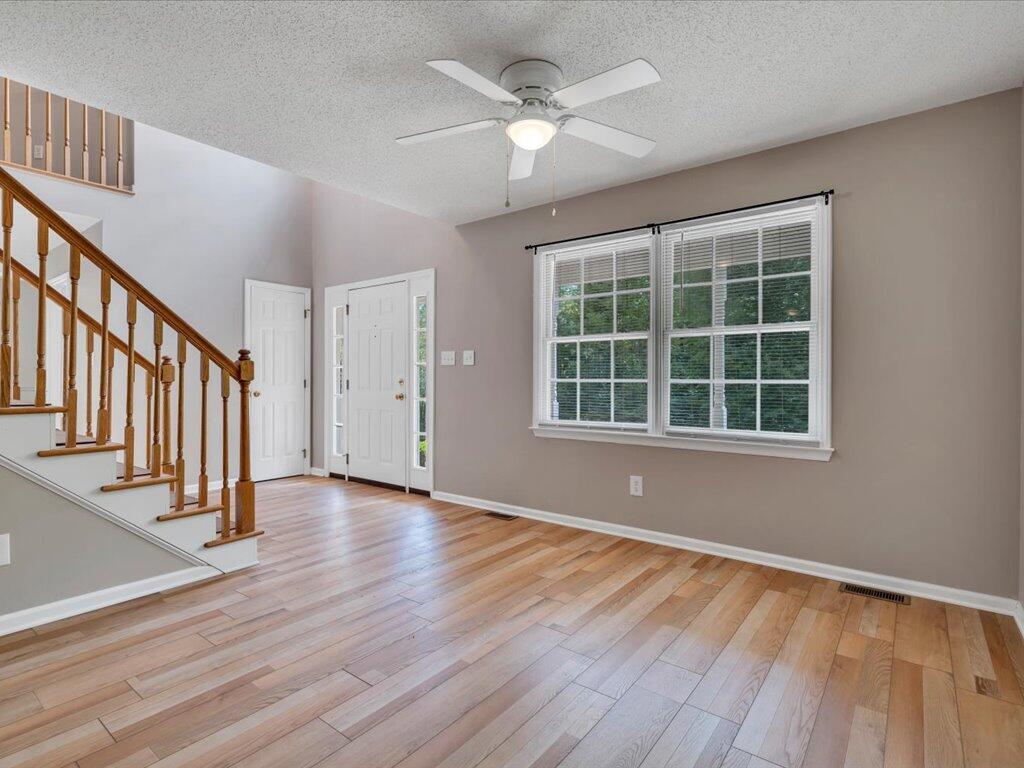 520 Scenic Drive Stuart, VA 24171 - Photo 14 of 83 a view of an empty room with wooden floor and a window