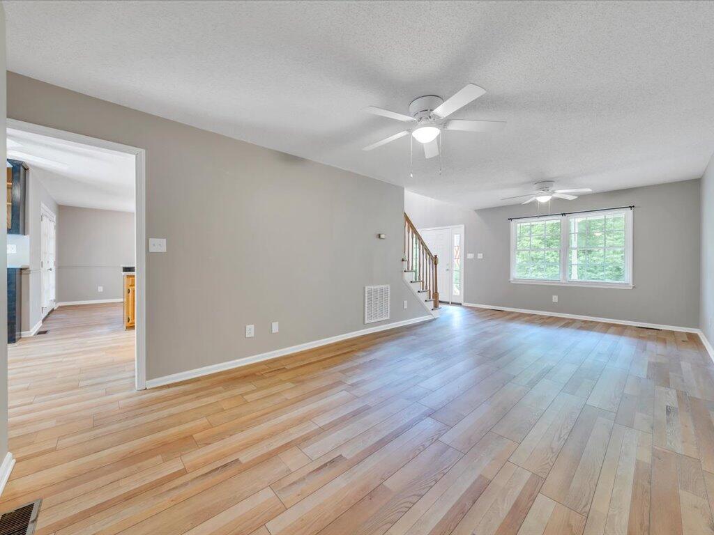 520 Scenic Drive Stuart, VA 24171 - Photo 16 of 83 an empty room with wooden floor and windows