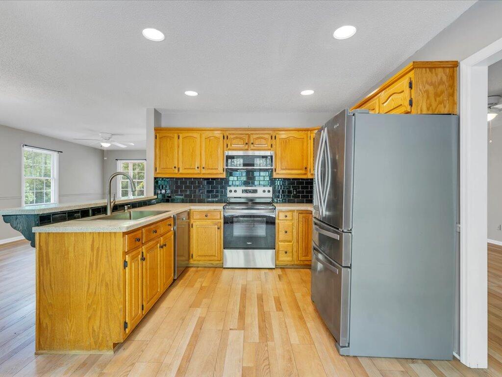 520 Scenic Drive Stuart, VA 24171 - Photo 18 of 83 a kitchen with stainless steel appliances granite countertop a stove a sink and a refrigerator