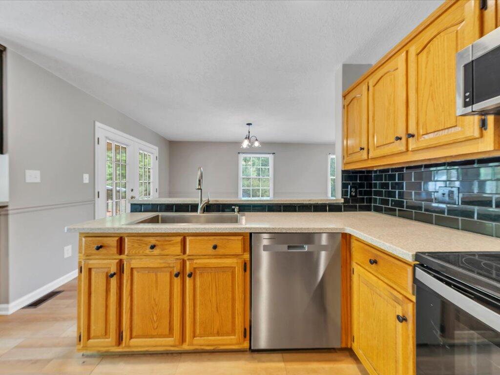 520 Scenic Drive Stuart, VA 24171 - Photo 20 of 83 a kitchen with granite countertop a sink stainless steel appliances and cabinets