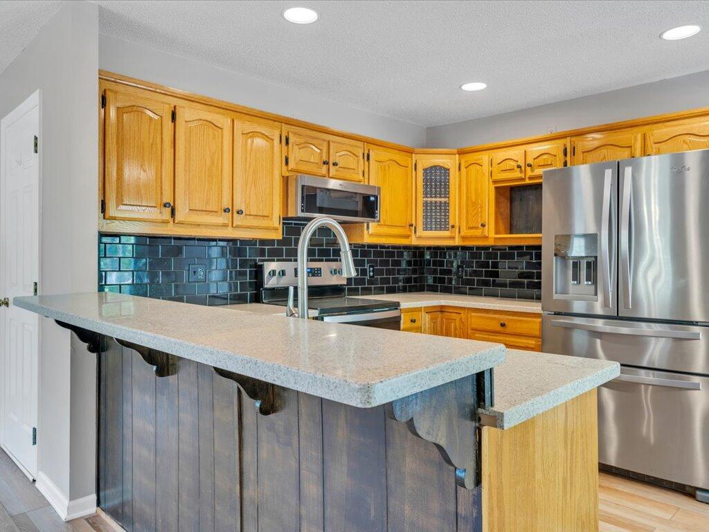 520 Scenic Drive Stuart, VA 24171 - Photo 23 of 83 a kitchen with stainless steel appliances a sink cabinets and a refrigerator