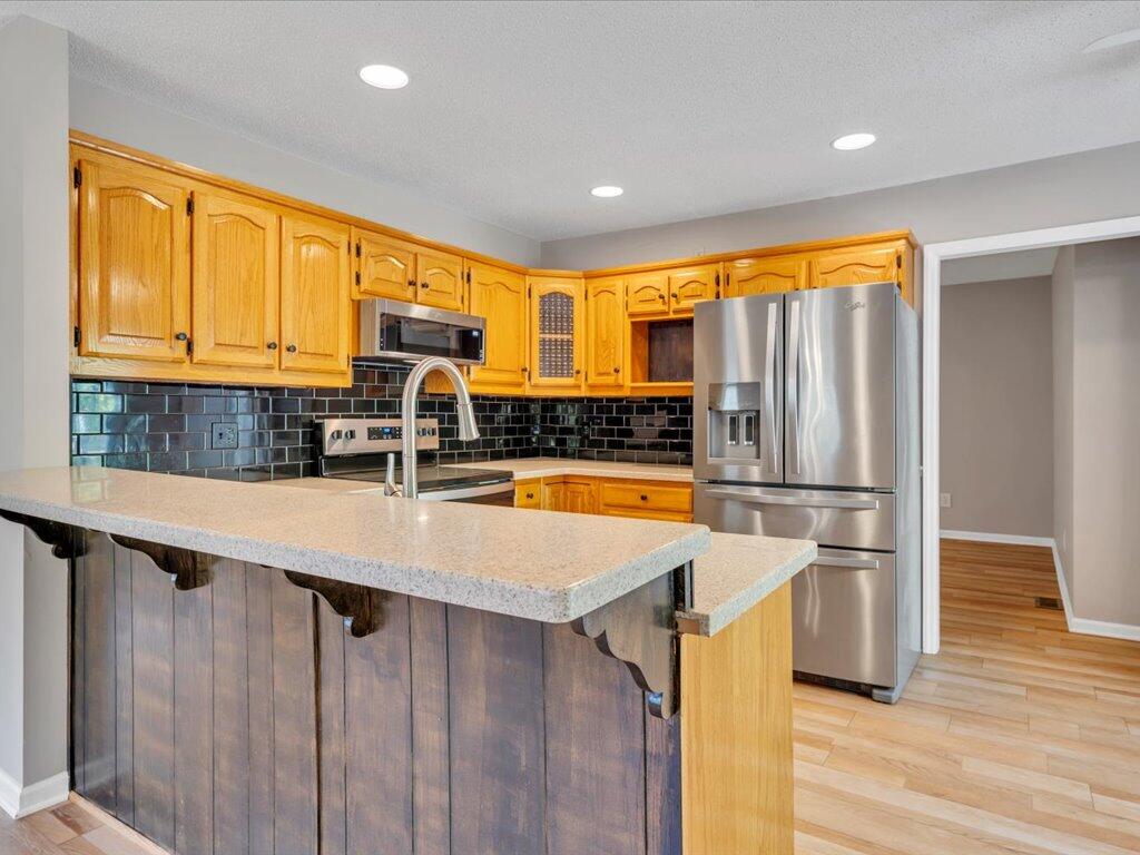 520 Scenic Drive Stuart, VA 24171 - Photo 24 of 83 a kitchen with stainless steel appliances a refrigerator sink and cabinets