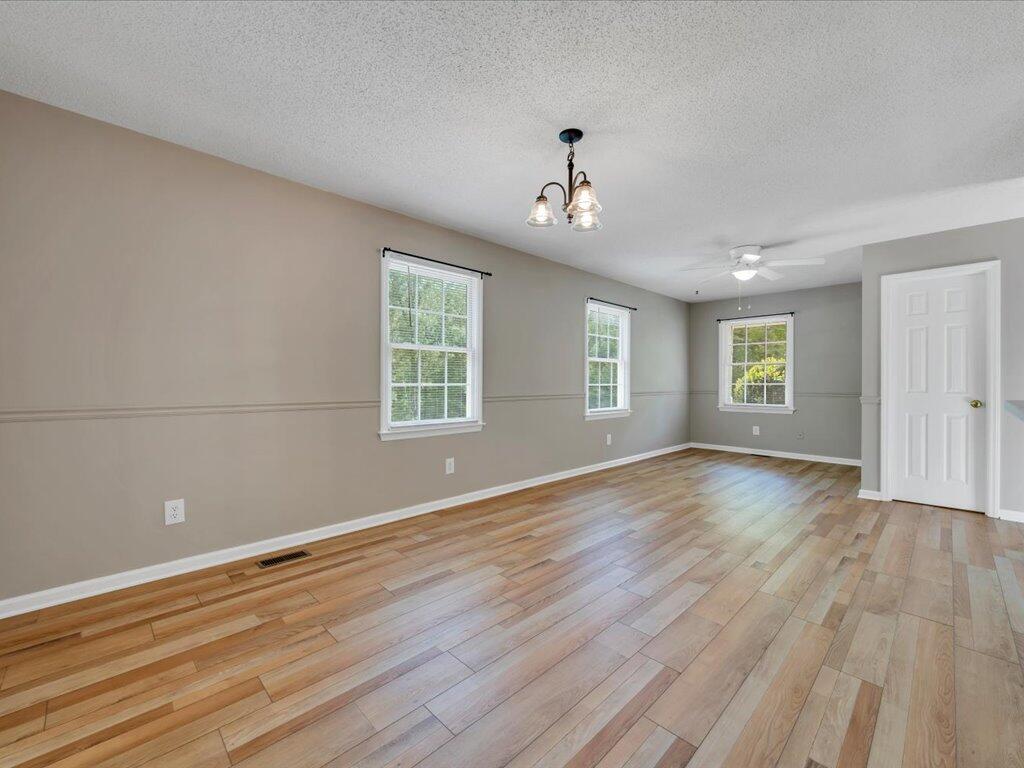 520 Scenic Drive Stuart, VA 24171 - Photo 25 of 83 an empty room with wooden floor and windows