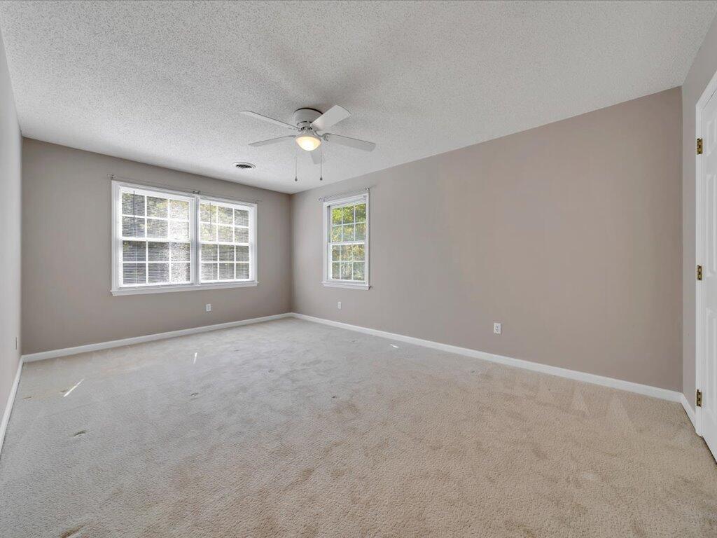 520 Scenic Drive Stuart, VA 24171 - Photo 39 of 83 an empty room with windows and ceiling fan