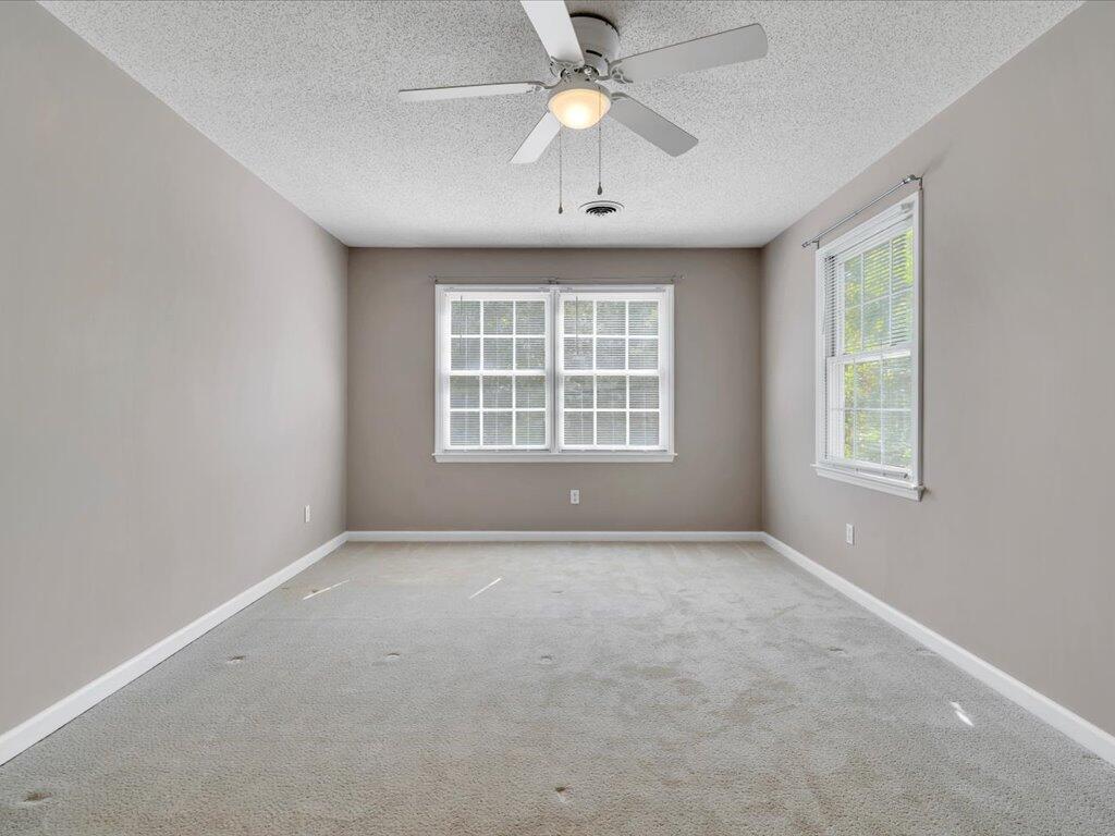 520 Scenic Drive Stuart, VA 24171 - Photo 40 of 83 an empty room with windows and a ceiling fan