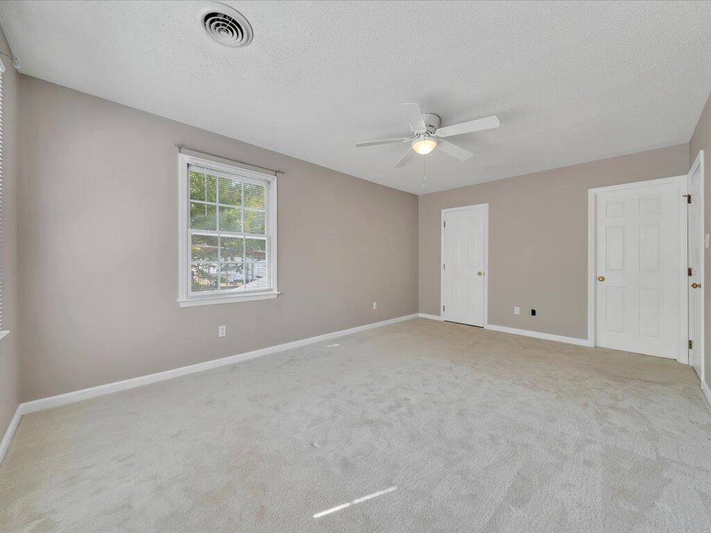 520 Scenic Drive Stuart, VA 24171 - Photo 41 of 83 an empty room with a window and a ceiling fan