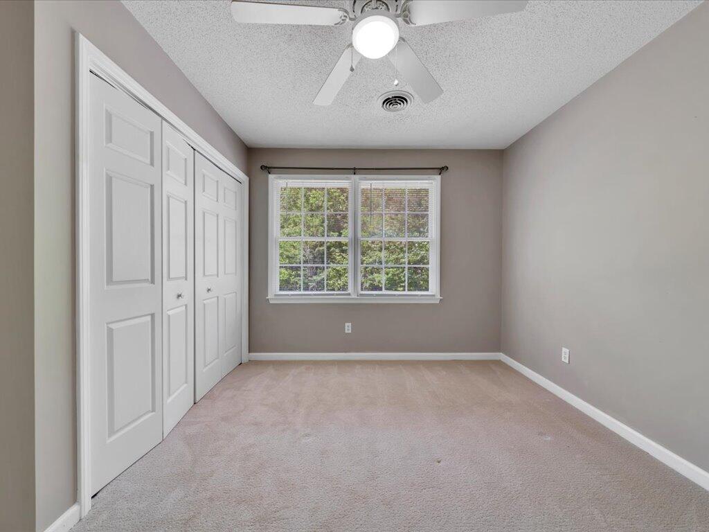 520 Scenic Drive Stuart, VA 24171 - Photo 46 of 83 an empty room with windows and fan