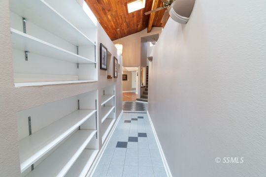 3835 West Ridgecrest Boulevard Ridgecrest, CA 93555 - Photo 30 of 50 a view of a hallway with wooden floor and staircase