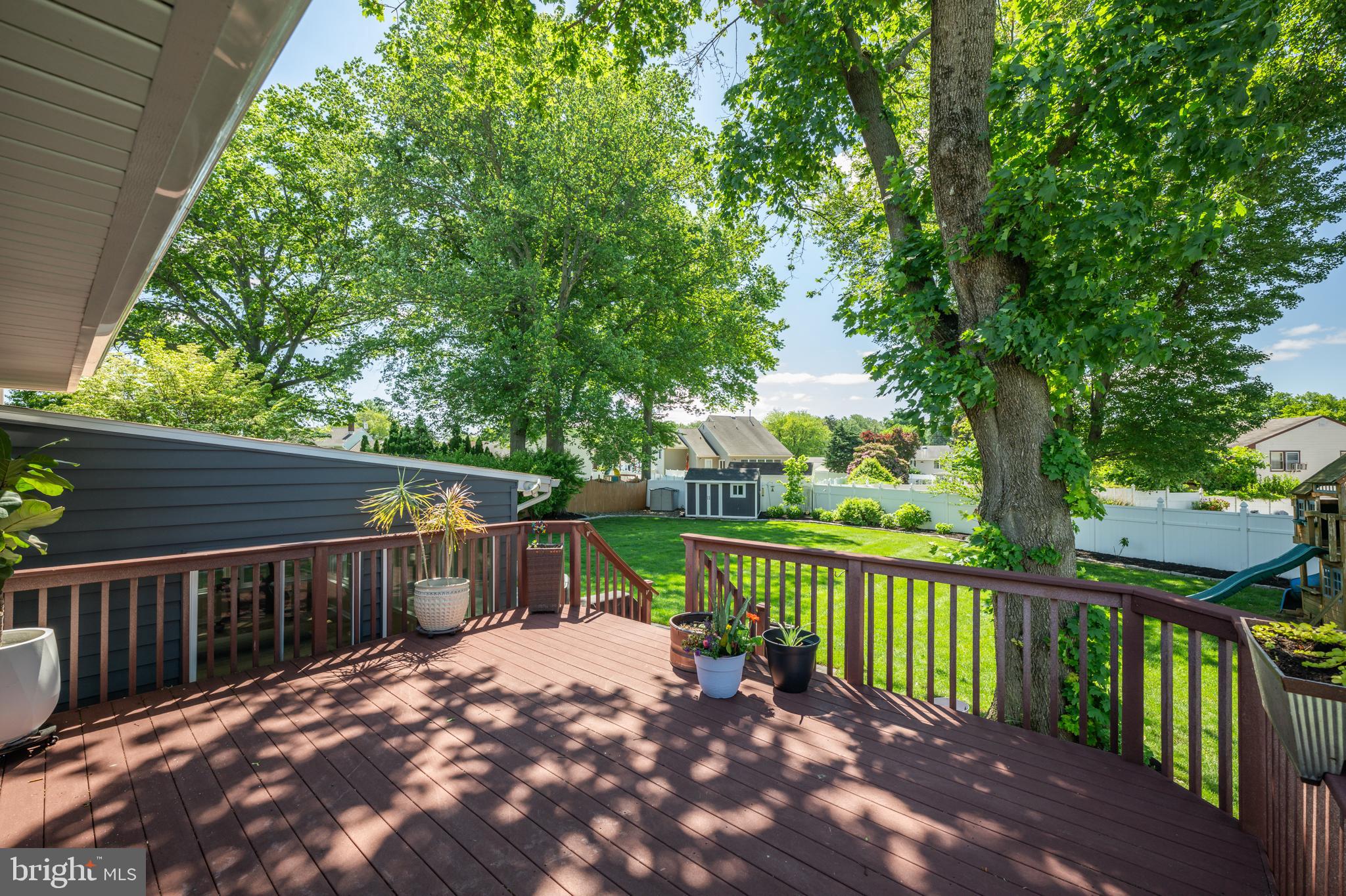 33 Dailey Drive Hamilton, NJ 08620 - Photo 21 of 27 a view of a wooden deck with trees