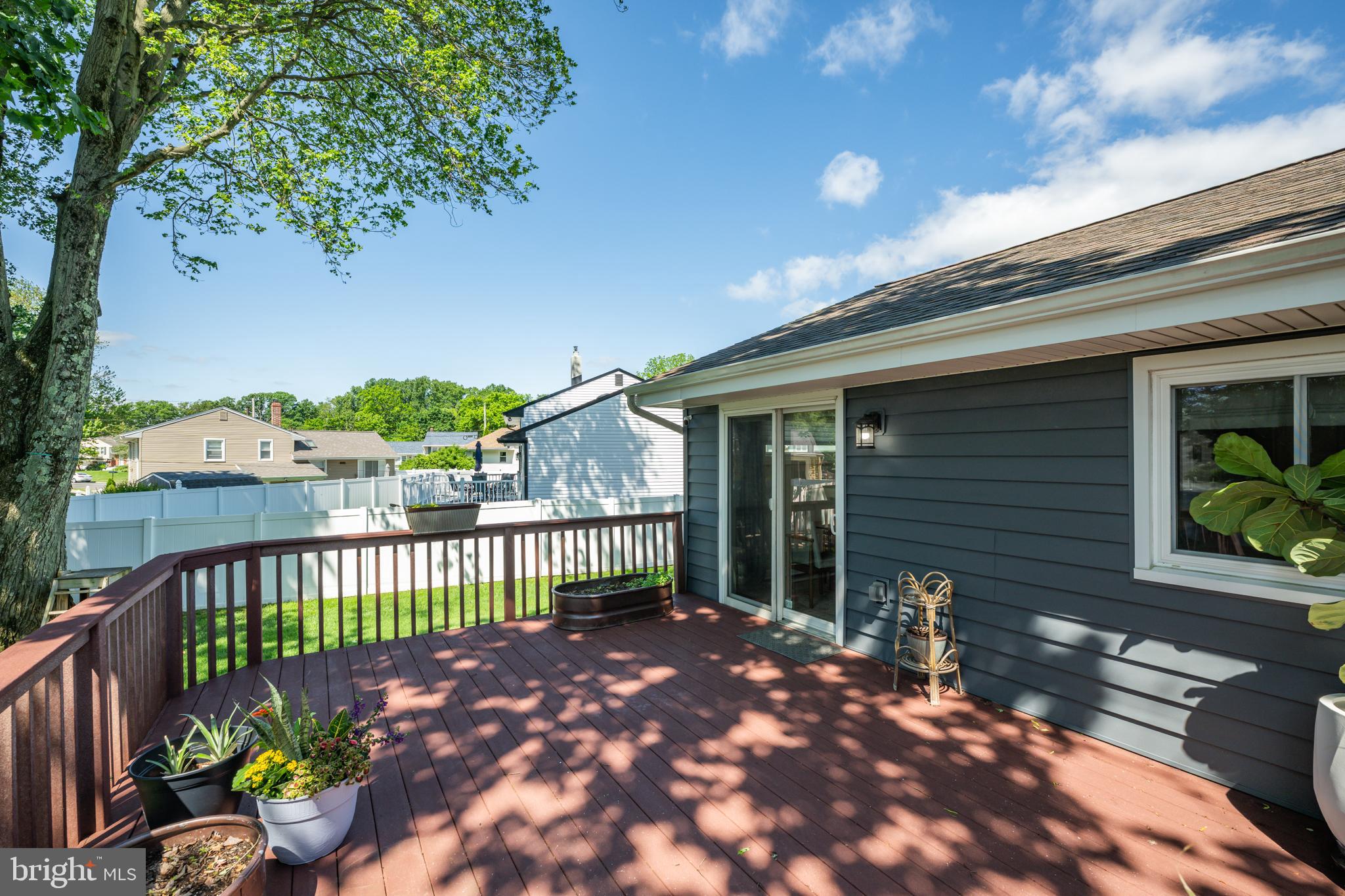 33 Dailey Drive Hamilton, NJ 08620 - Photo 22 of 27 a view of a house with a small yard and wooden fence