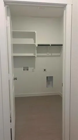 a view of an empty room with a fireplace