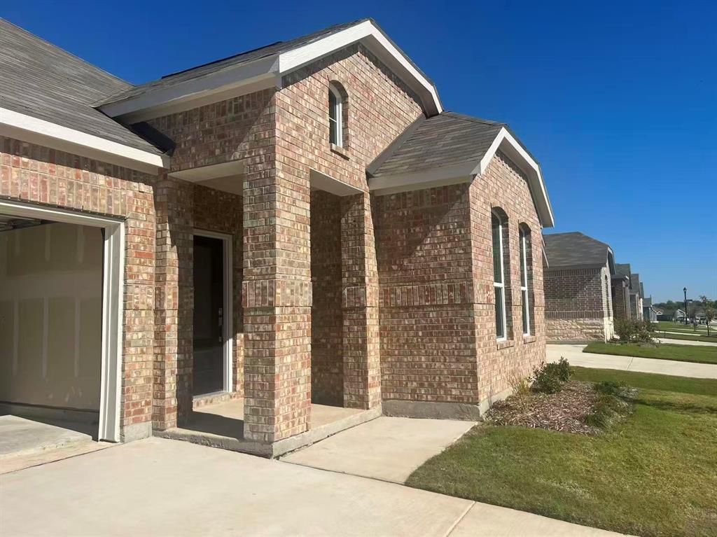 909 Calley Pear Trail Princeton, TX 75407 - Photo 2 of 17 a front view of a house with a yard