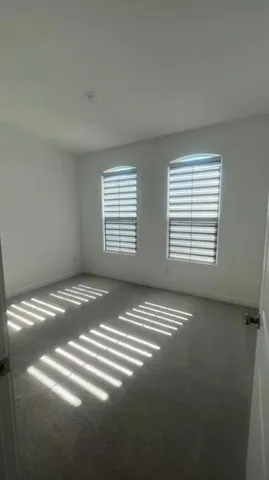 a view of empty room with windows