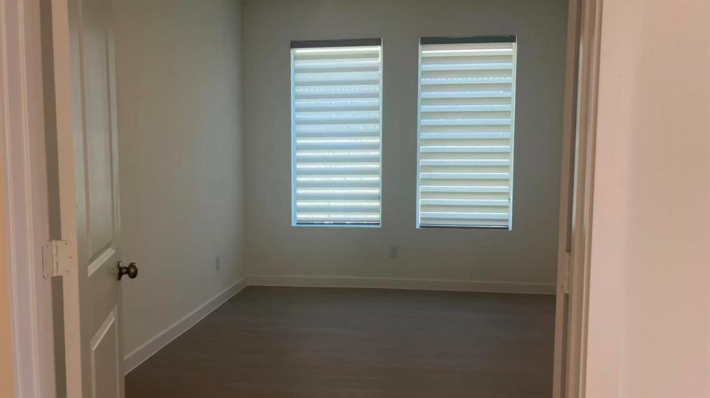 909 Calley Pear Trail Princeton, TX 75407 - Photo 9 of 17 a view of a room that has a window in it