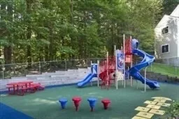 a childrens park with lots of swings and slides