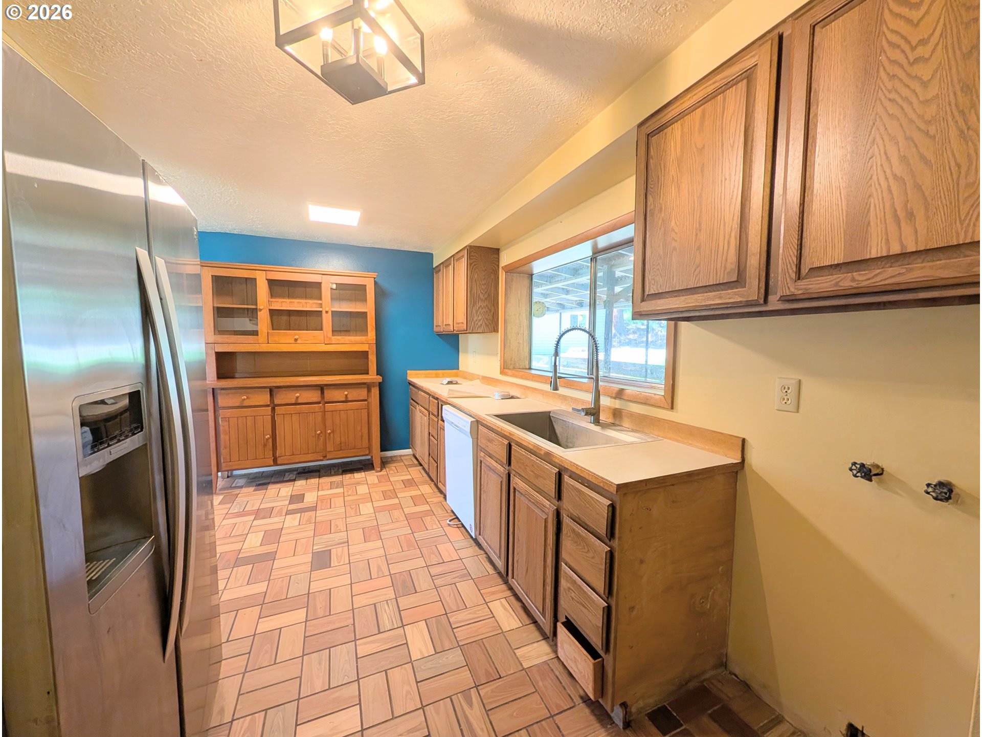 1624 Foley Street La Grande, OR 97850 - Photo 15 of 37 a kitchen with stainless steel appliances granite countertop a refrigerator a sink a stove and oven