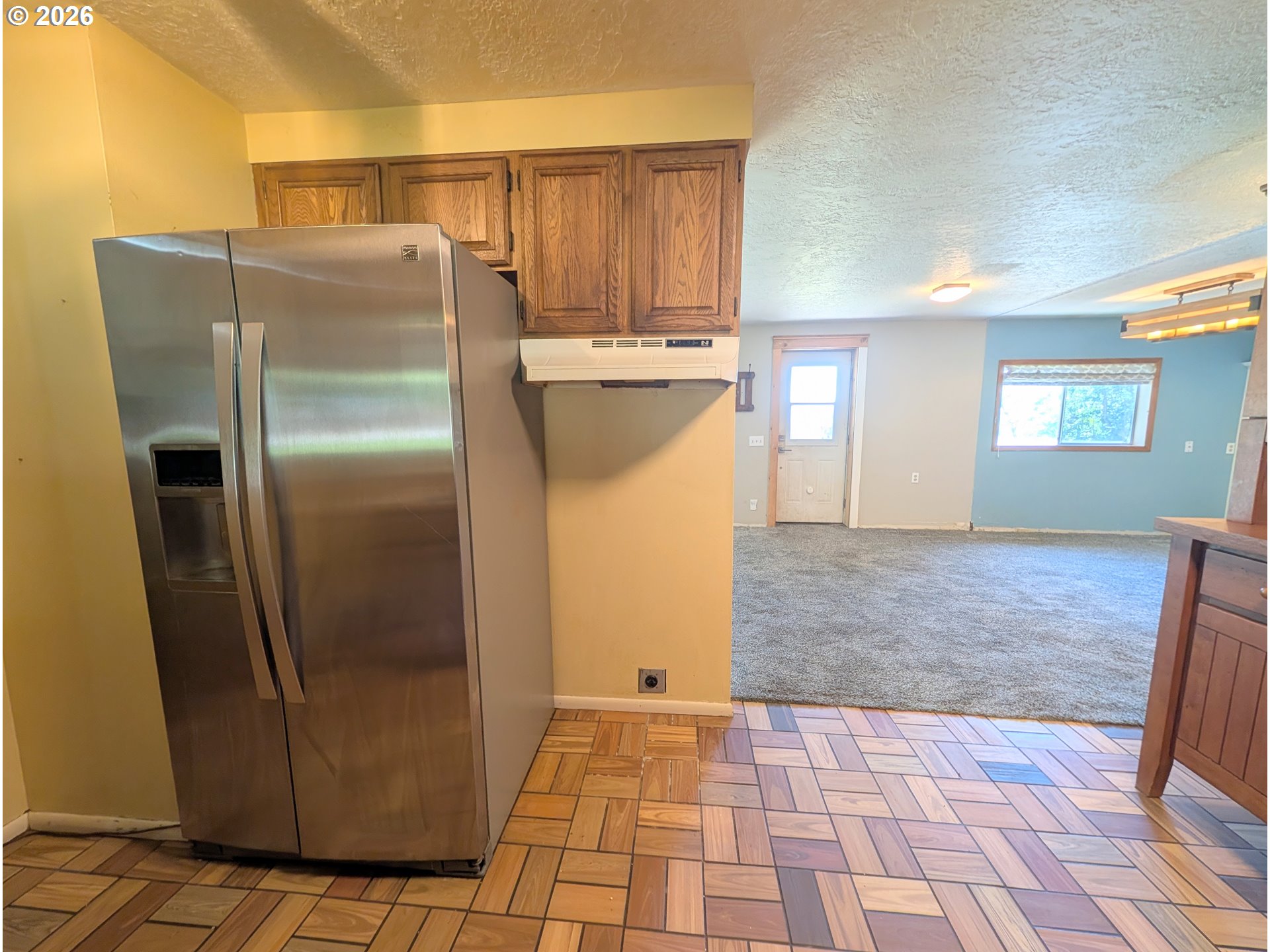1624 Foley Street La Grande, OR 97850 - Photo 17 of 37 a kitchen with stainless steel appliances granite countertop a refrigerator and a sink