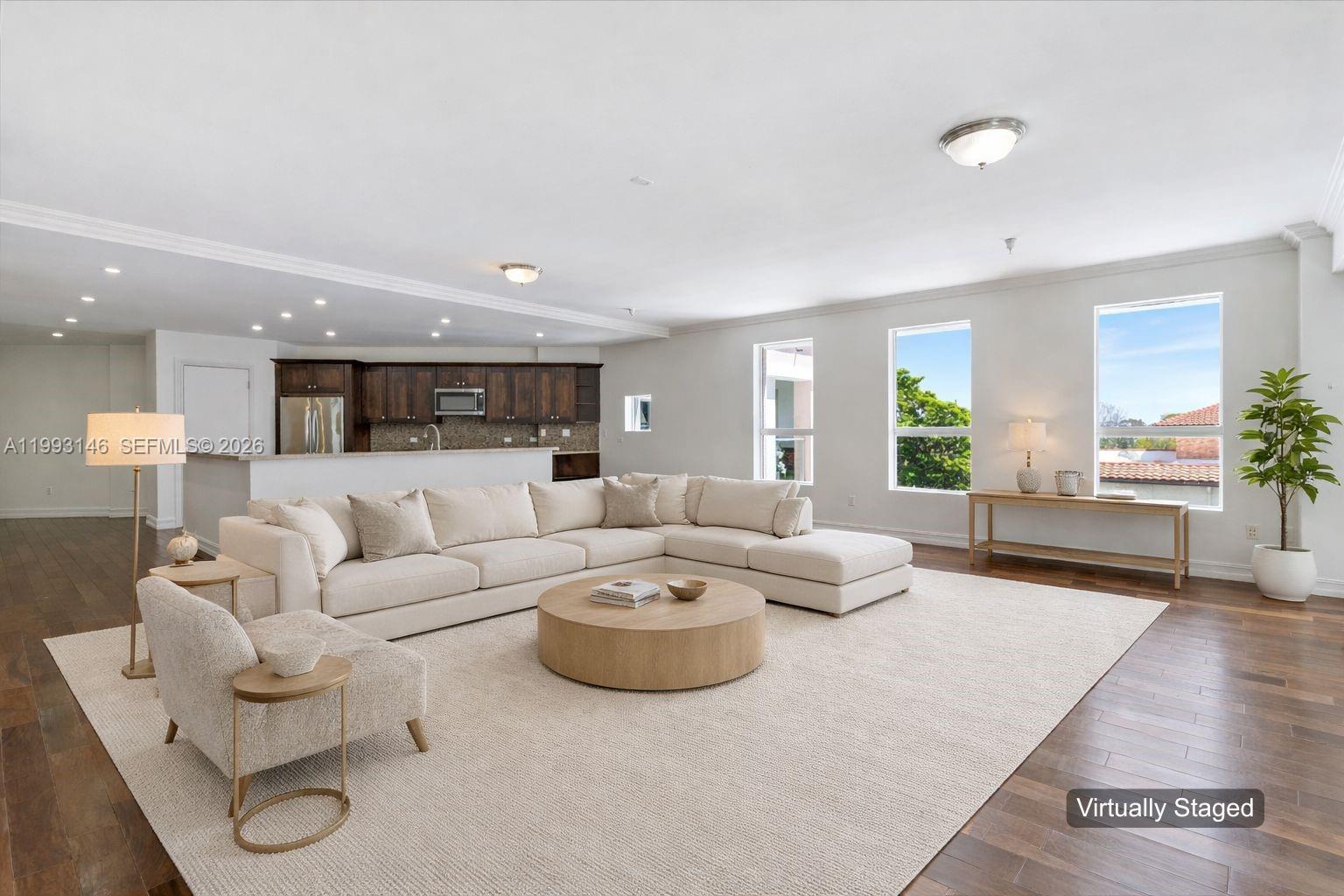 a living room with furniture and a large window